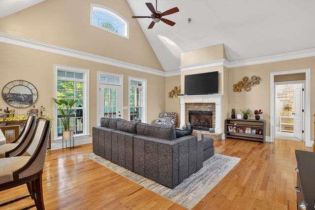 8179 Pineview Court Villa Rica, GA 30180 - Photo 5 of 41 a living room with furniture a flat screen tv and a fireplace