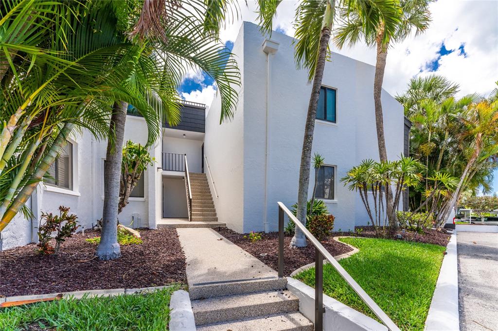 2955 North Beach Road, Unit B614 Englewood, FL 34223 - Photo 1 of 67 a front view of a house with a yard