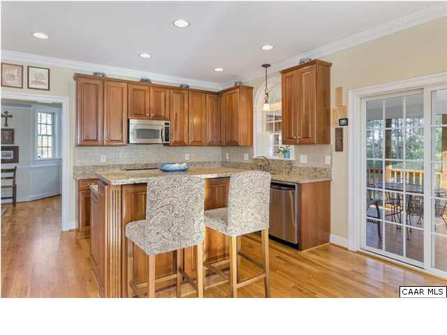 21 Ridgeview Drive Ruckersville, VA 22968 - Photo 11 of 41 a kitchen with kitchen island granite countertop wooden cabinets and a granite counter top
