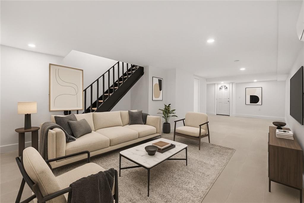 371 Grant Avenue Brooklyn, NY 11208 - Photo 15 of 19 a living room with furniture and a couch