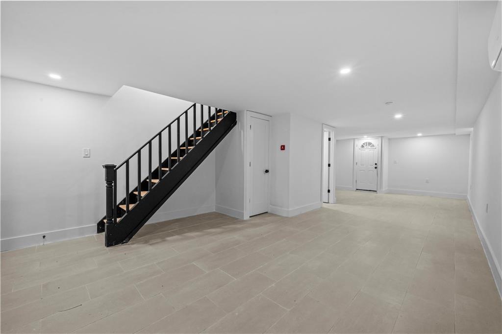 371 Grant Avenue Brooklyn, NY 11208 - Photo 16 of 19 a view of an empty room with stairs