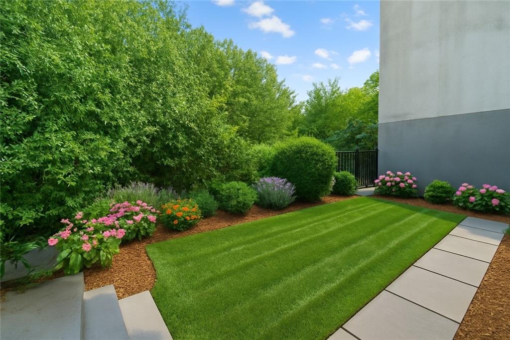 371 Grant Avenue Brooklyn, NY 11208 - Photo 19 of 19 a view of a garden with flowers and trees