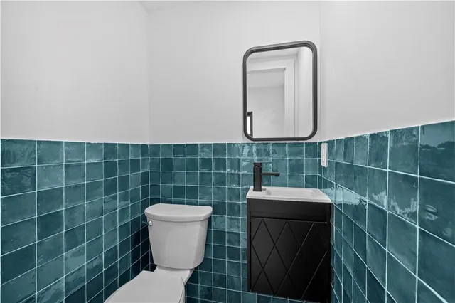 a bathroom with a toilet and a sink