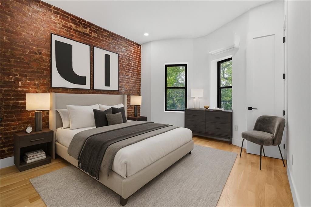 371 Grant Avenue Brooklyn, NY 11208 - Photo 10 of 19 a spacious bedroom with a bed and window