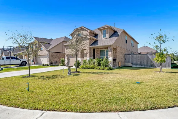 a view of a house with swimming pool and a yard