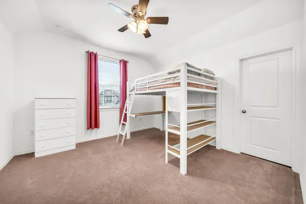 a view of an empty room with a cabinet