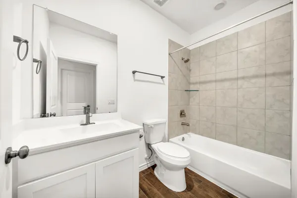 a bathroom with a sink a toilet and a bathtub