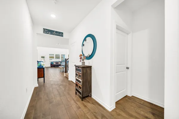 a view of living room with furniture and wooden floor