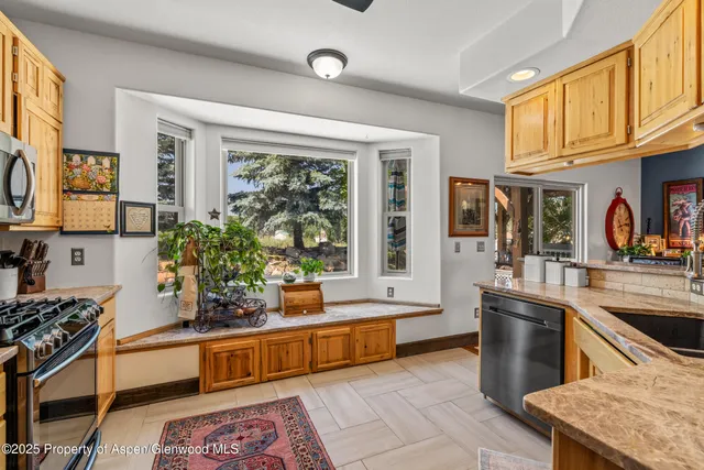 a bed sitting in a room next to a window