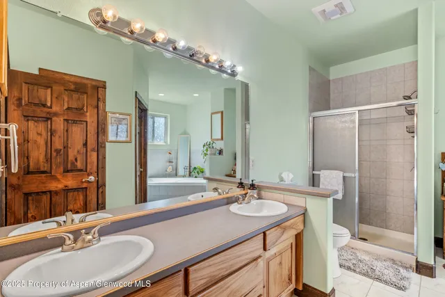 a bedroom with bed and a window