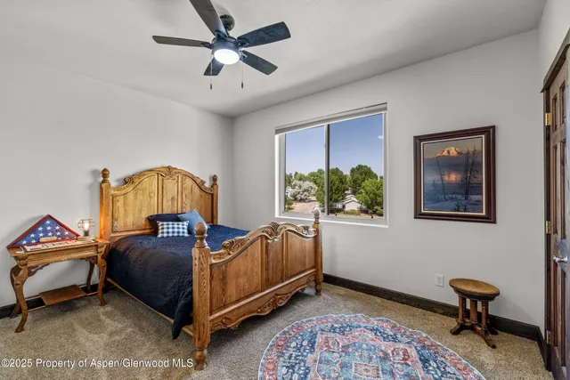 a bathroom with a granite countertop sink toilet a mirror and shower