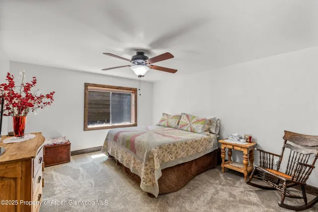 a bathroom with a granite countertop sink mirror and a bathtub