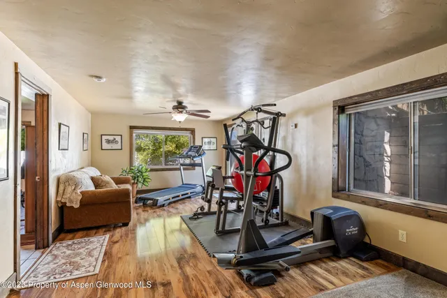 a view of a livingroom with furniture and a window