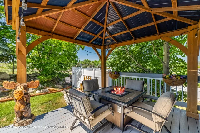 a view of a patio with a yard