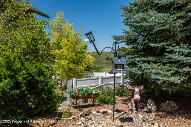 a view of a house with a yard and garage