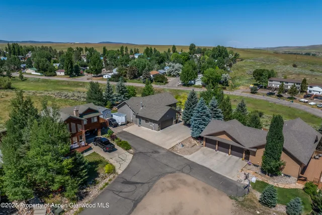an aerial view of a house with outdoor space patio and mountain view
