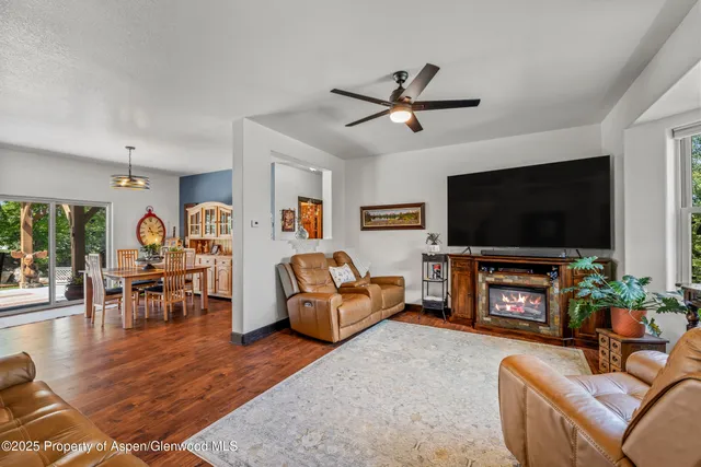 a living room with furniture and a flat screen tv