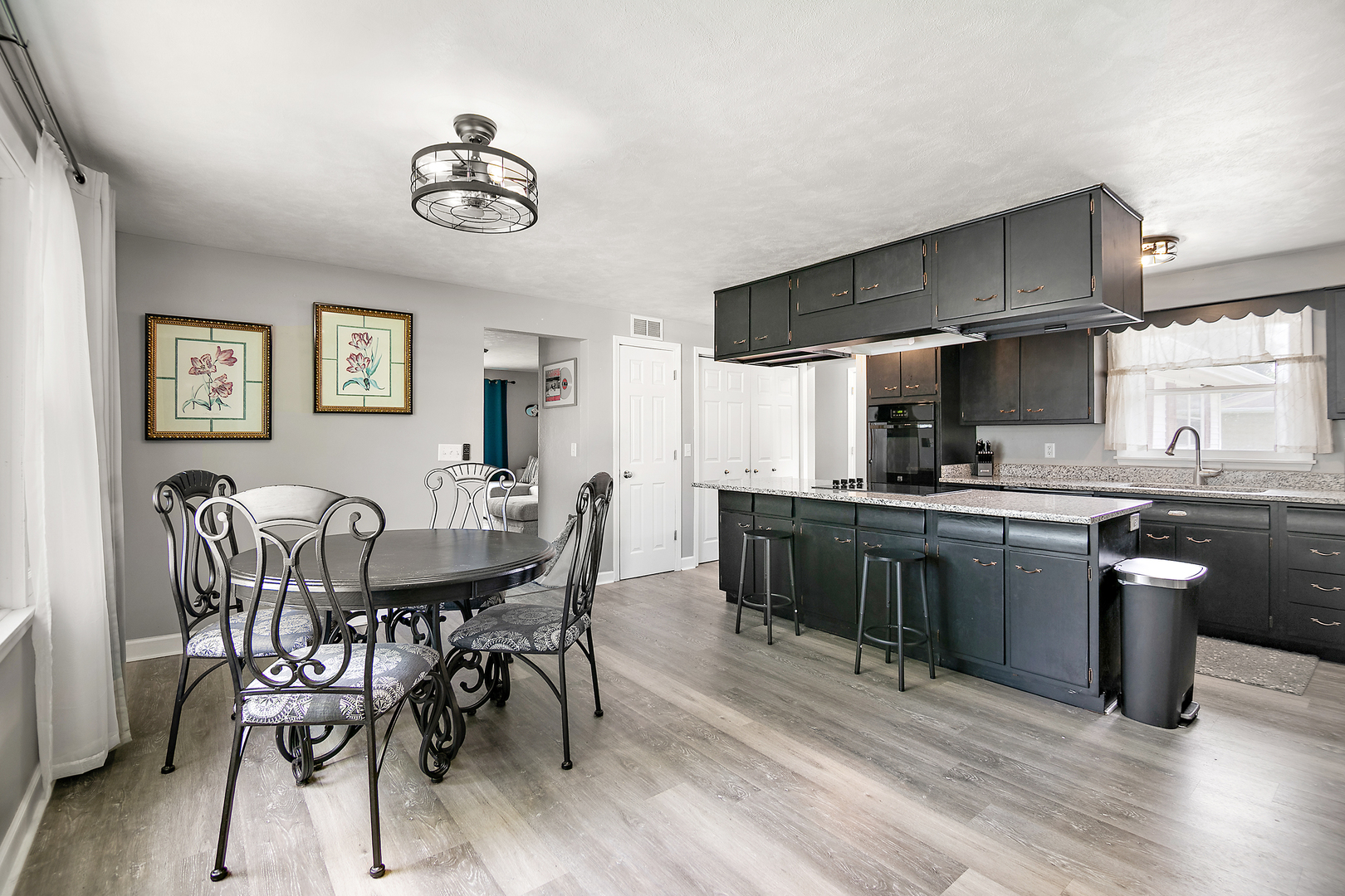 1572 North 2000E Road Bourbonnais, IL 60914 - Photo 5 of 18 a view of kitchen with sink dining table and chairs