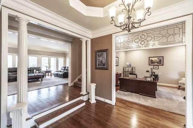 a kitchen with granite countertop a sink stainless steel appliances and cabinets