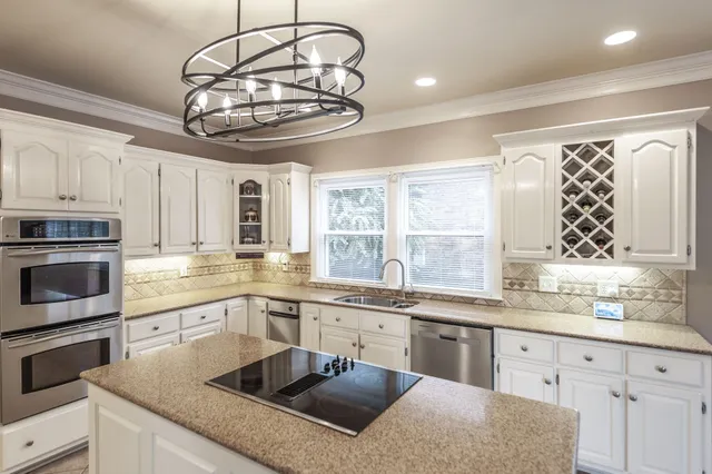 a view of a dining room with furniture and windows