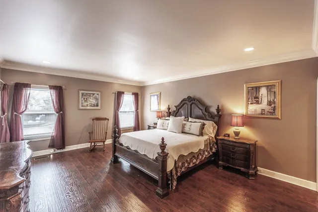a bathroom with a double vanity sink mirror and shower