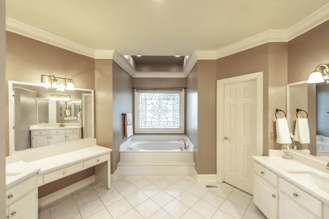 a living room with furniture a wooden floor and a flat screen tv