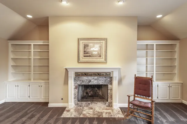a living room with a bed and a window