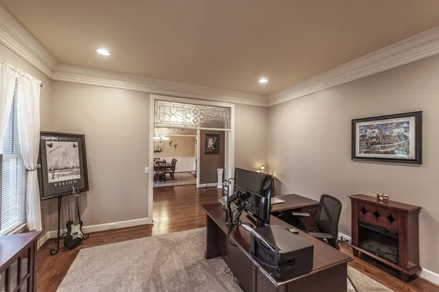 a living room with furniture and a rug