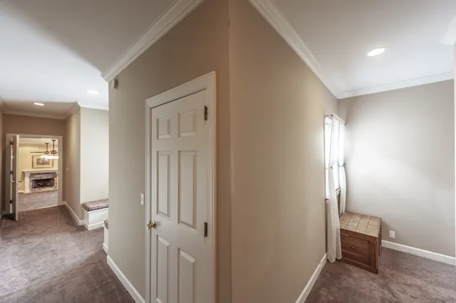 a view of a patio with table and chairs and wooden floor
