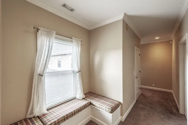 a room with a bed and a view of bedroom