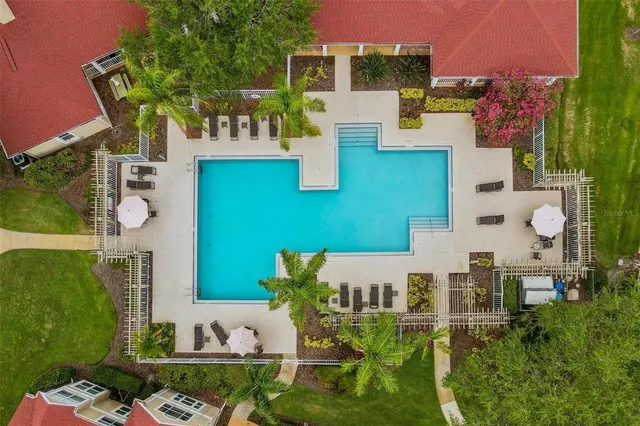 an aerial view of a house with outdoor space patio and seating area