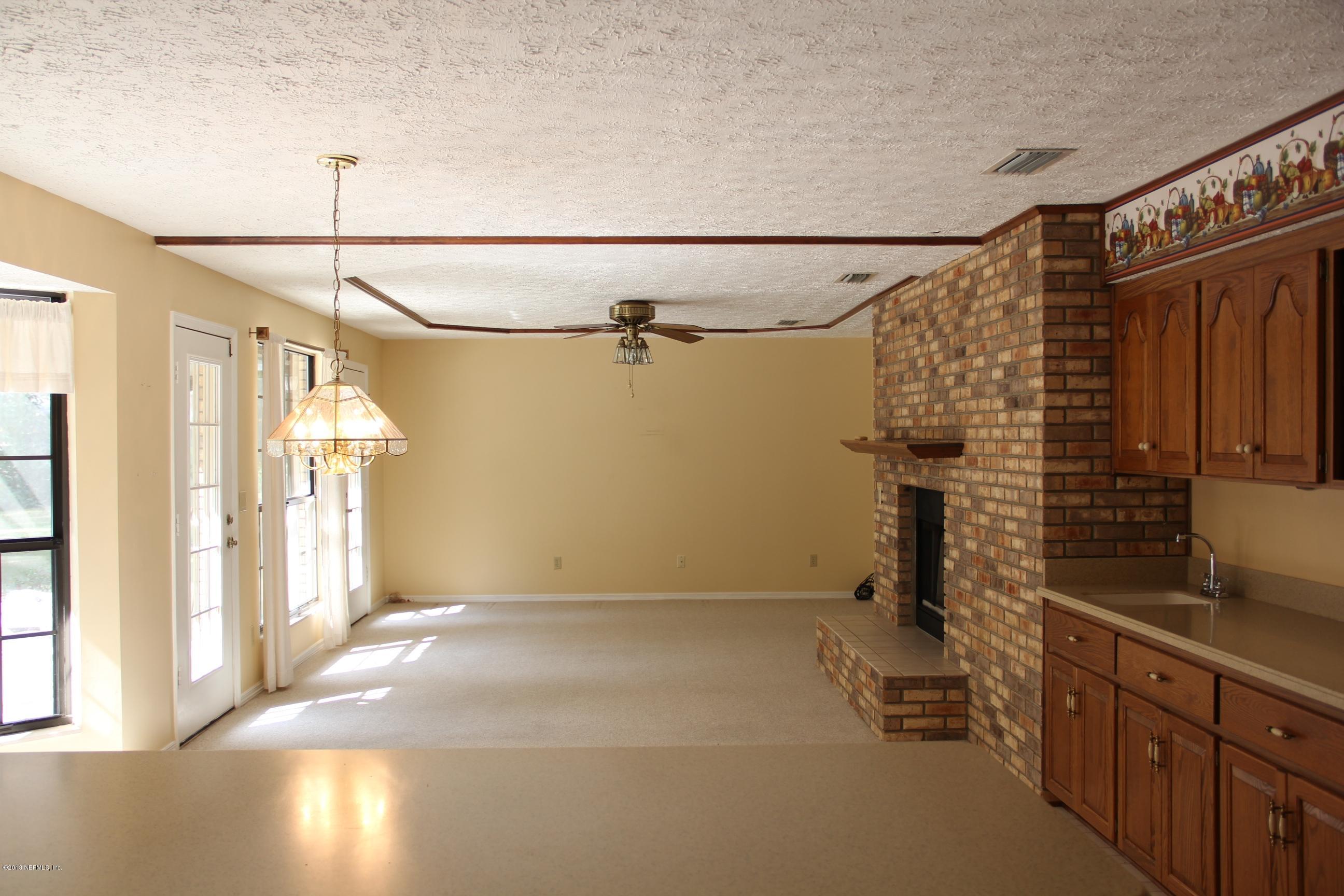 1386 Ree Street Starke, FL 32091 - Photo 20 of 36 Dining room with fireplace.