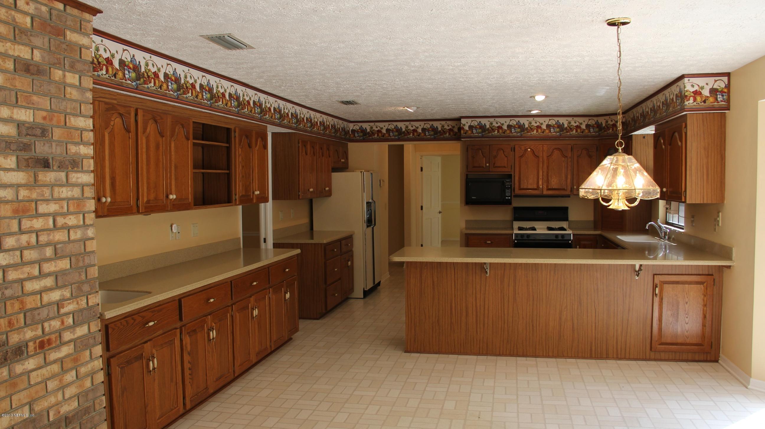 1386 Ree Street Starke, FL 32091 - Photo 24 of 36 view of more cabinets in kitchen area