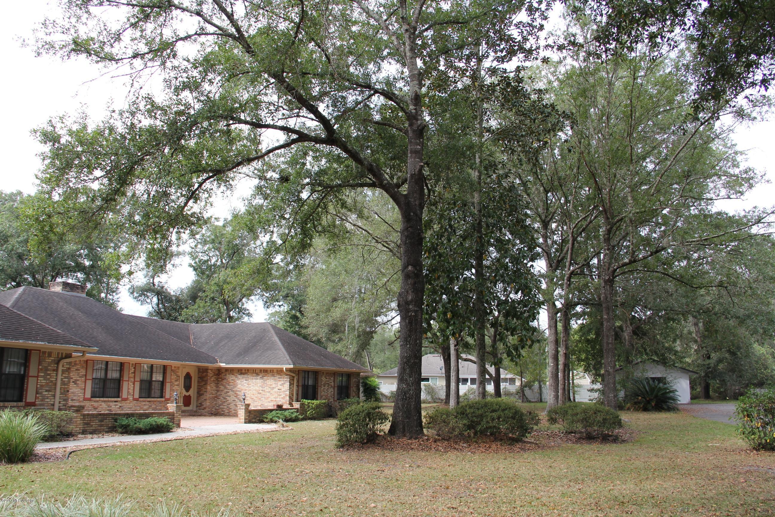 1386 Ree Street Starke, FL 32091 - Photo 9 of 36 Side view of the front yard with trees