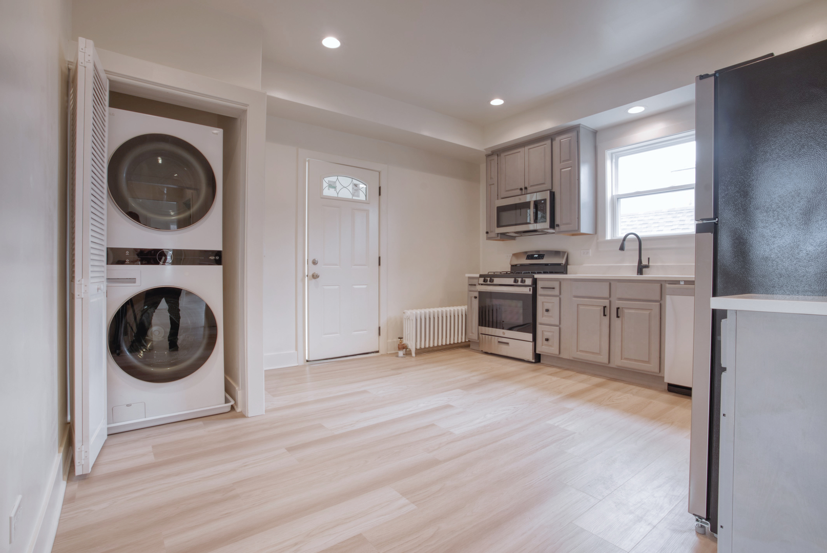 418 Ridge Road, Unit 2 Wilmette, IL 60091 - Photo 11 of 17 a view of a kitchen with a sink a washer and dryer