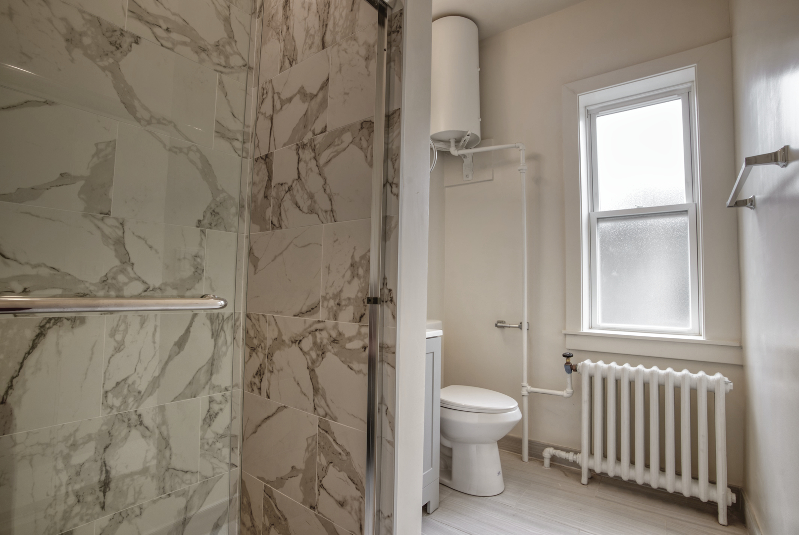 418 Ridge Road, Unit 2 Wilmette, IL 60091 - Photo 13 of 17 a bathroom with a toilet and a shower
