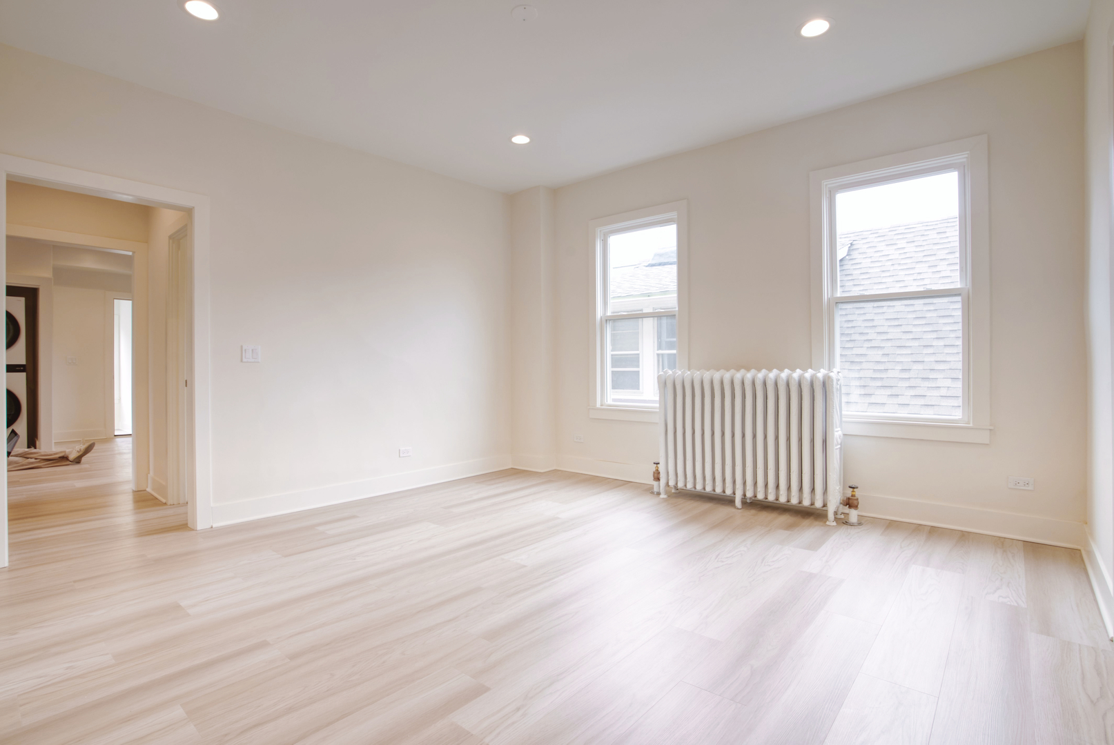 418 Ridge Road, Unit 2 Wilmette, IL 60091 - Photo 7 of 17 an empty room with wooden floor and windows