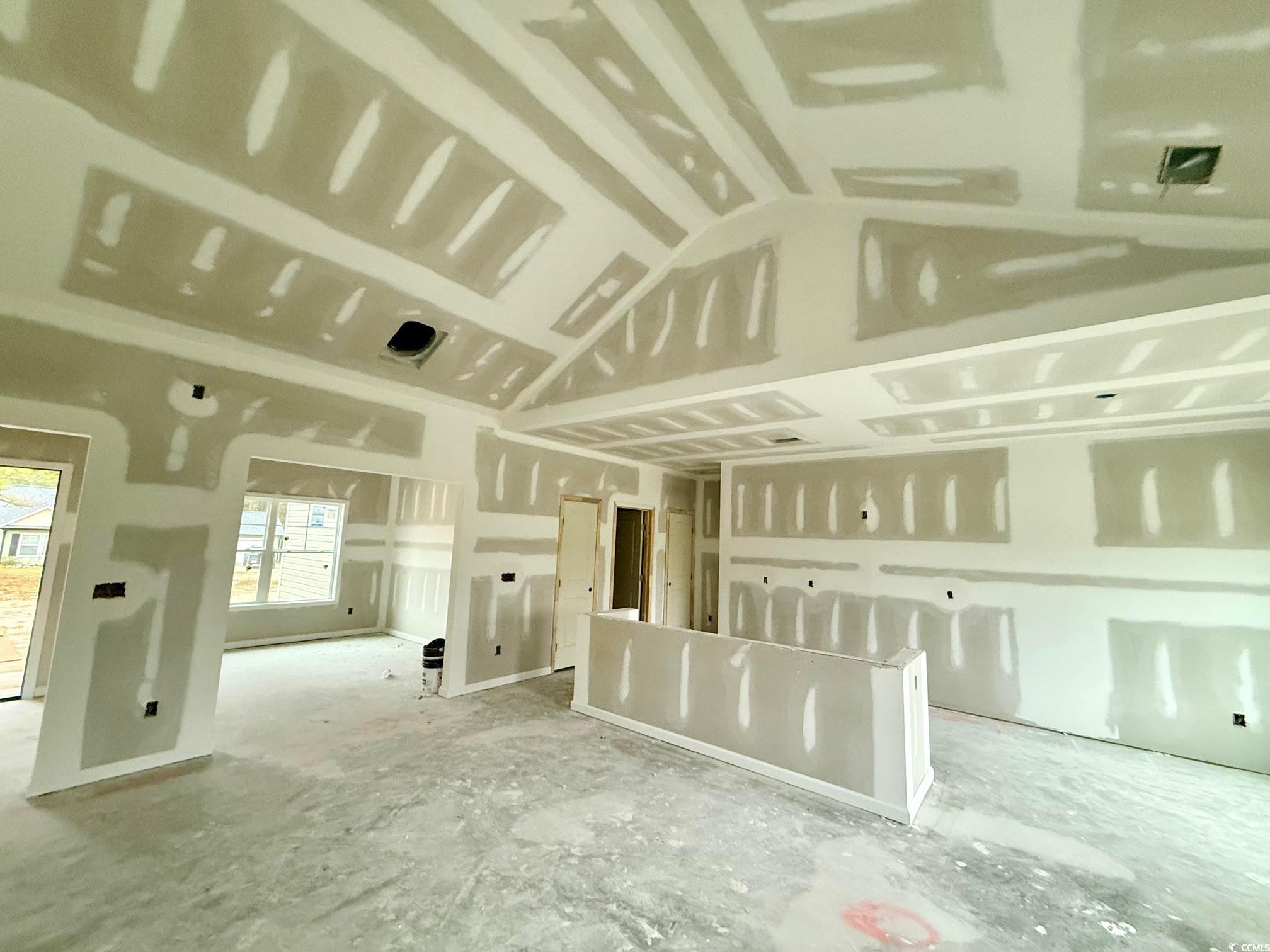 282 Lexyryan Court Latta, SC 29565 - Photo 8 of 8 Unfurnished room featuring vaulted ceiling