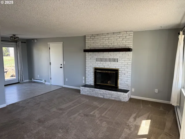 an empty room with a fireplace