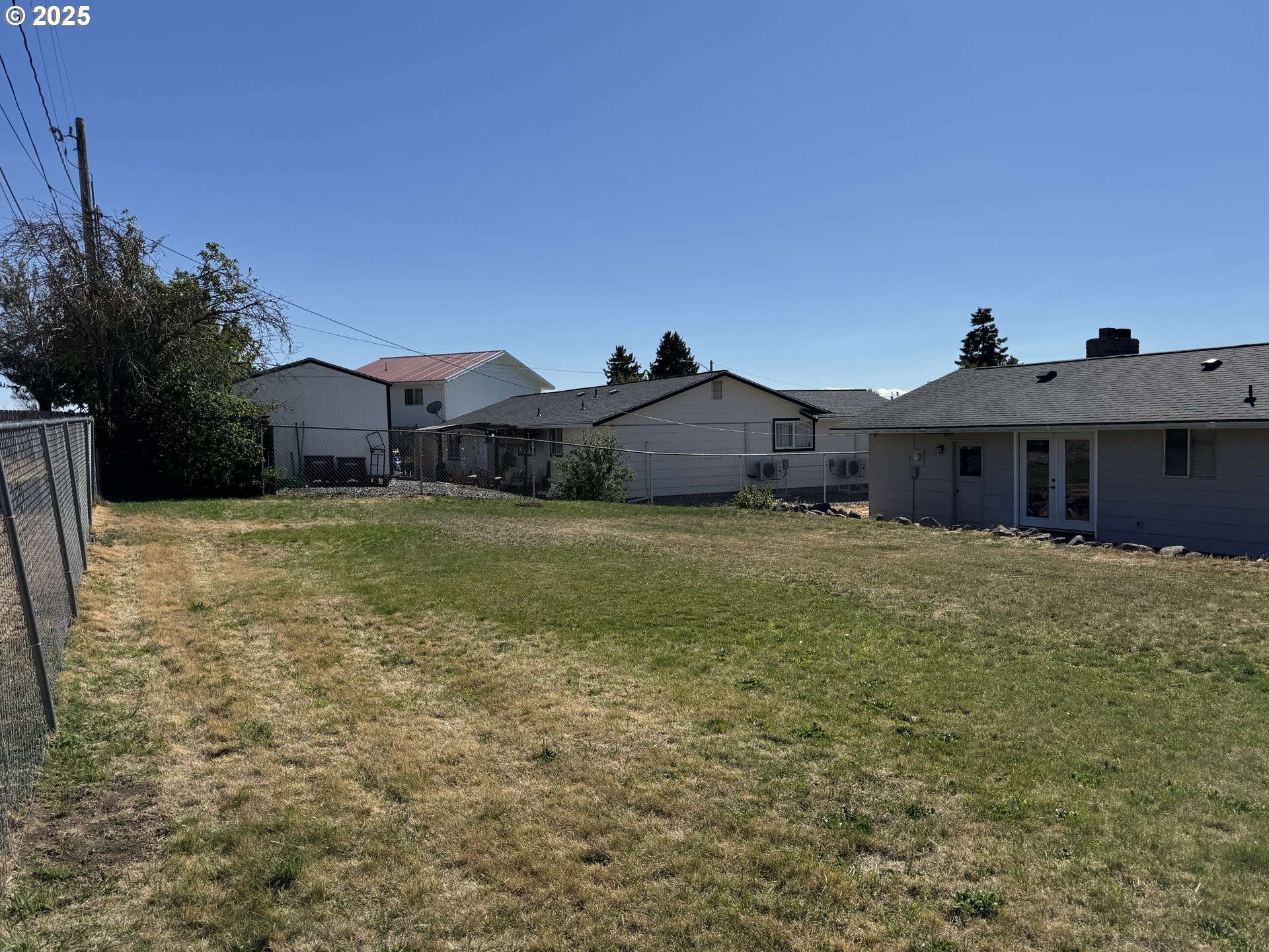 328 Allison Way Goldendale, WA 98620 - Photo 29 of 31 a large house with a big yard and large trees