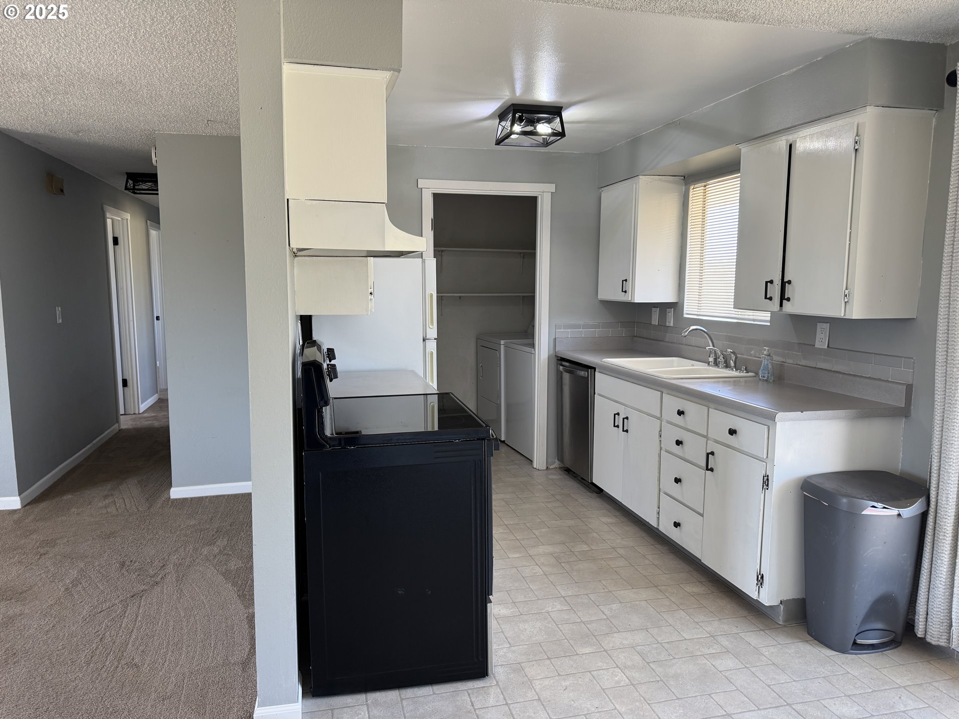 328 Allison Way Goldendale, WA 98620 - Photo 7 of 31 a kitchen with cabinets a sink and appliances