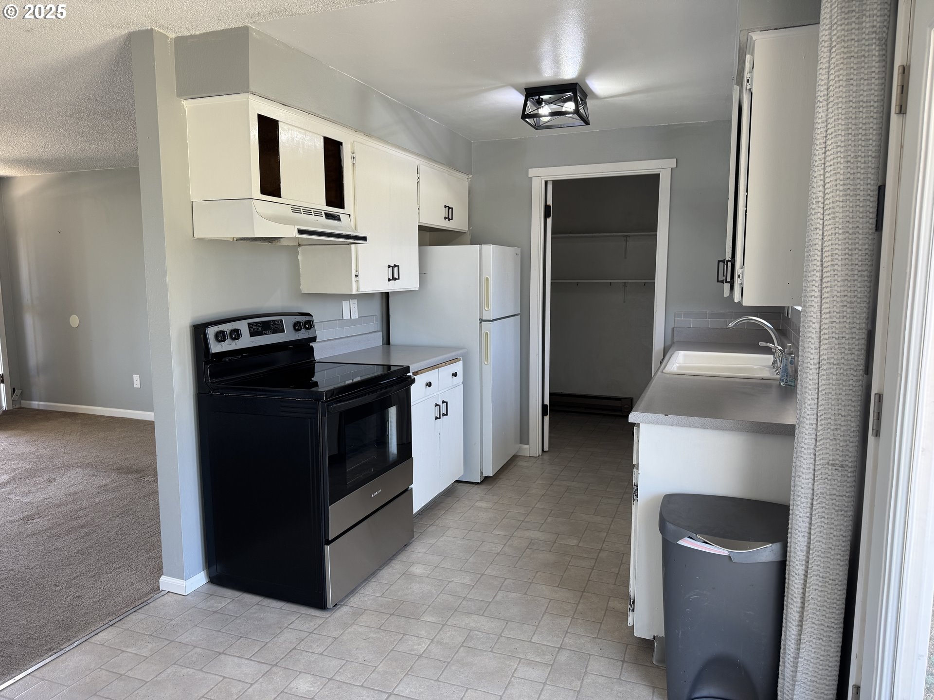 328 Allison Way Goldendale, WA 98620 - Photo 9 of 31 a kitchen with stainless steel appliances granite countertop a refrigerator a stove and a sink
