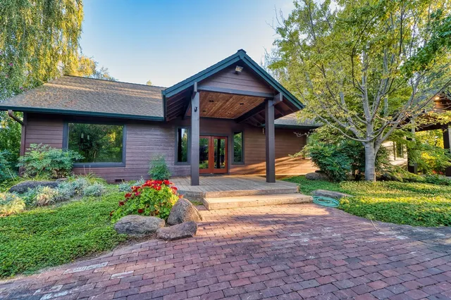 a front view of a house with garden