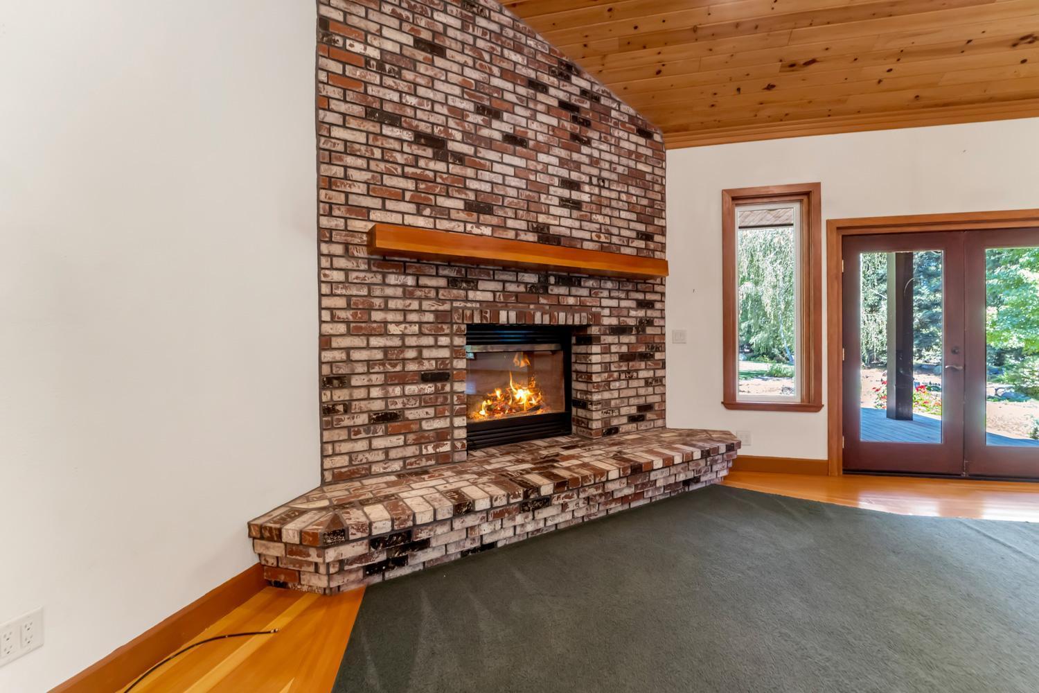 683 Stewart Road Yuba City, CA 95991 - Photo 15 of 55 a living room with furniture and a fireplace