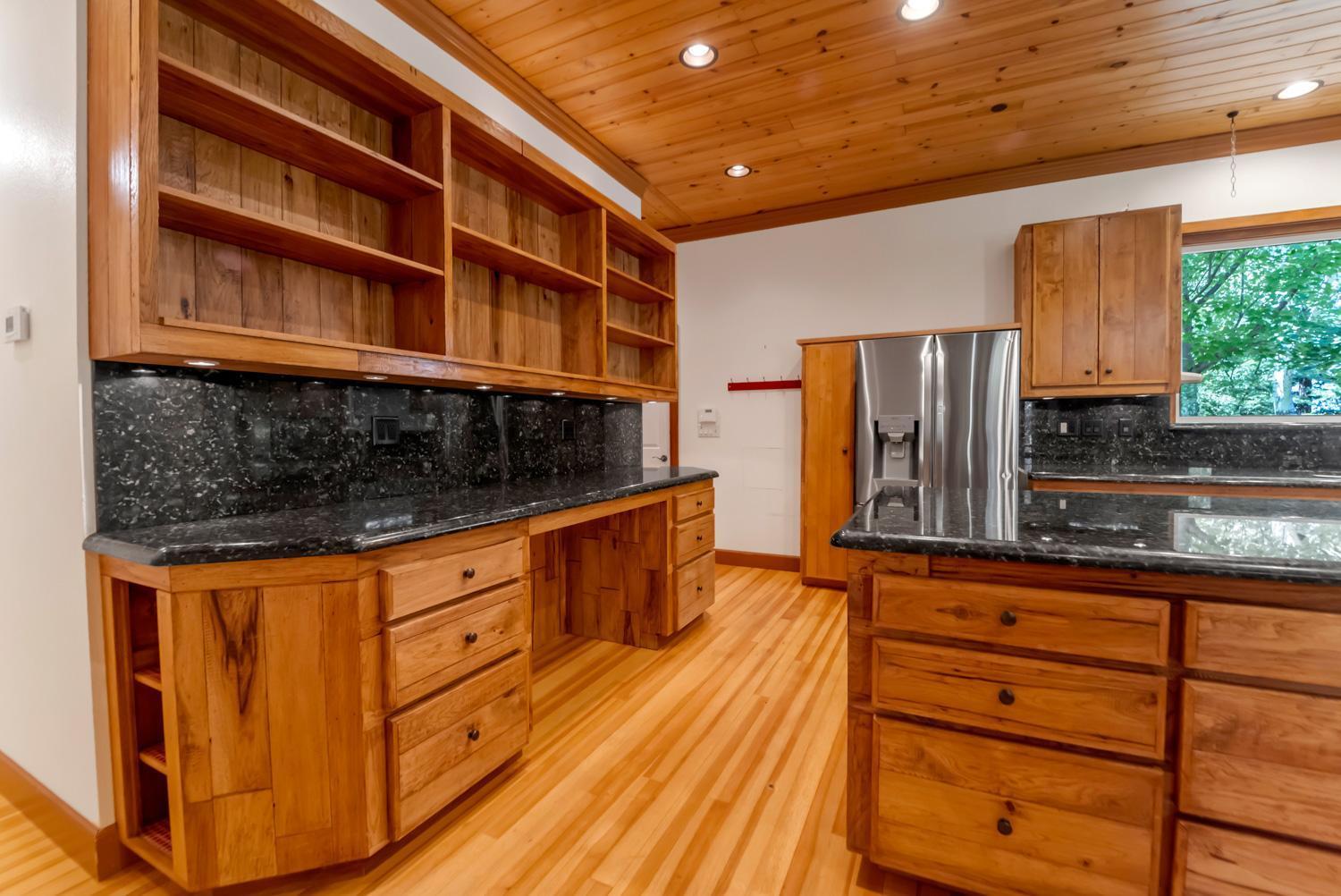 683 Stewart Road Yuba City, CA 95991 - Photo 17 of 55 a kitchen with stainless steel appliances granite countertop a stove a sink and a refrigerator