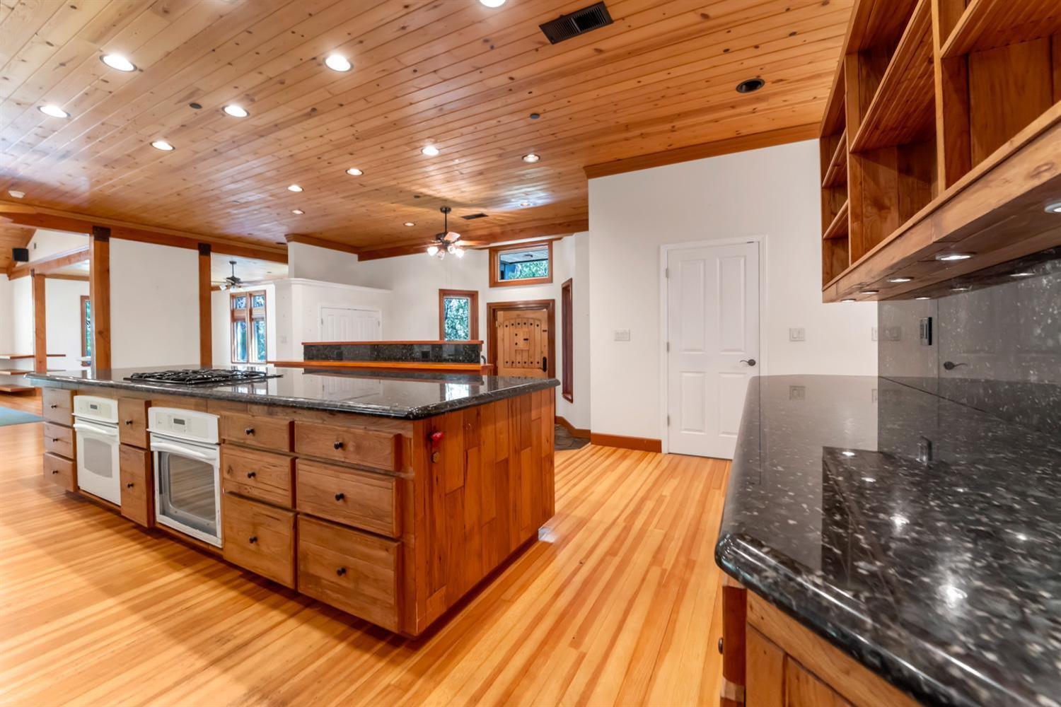 683 Stewart Road Yuba City, CA 95991 - Photo 19 of 55 a kitchen with stainless steel appliances granite countertop a stove and a sink