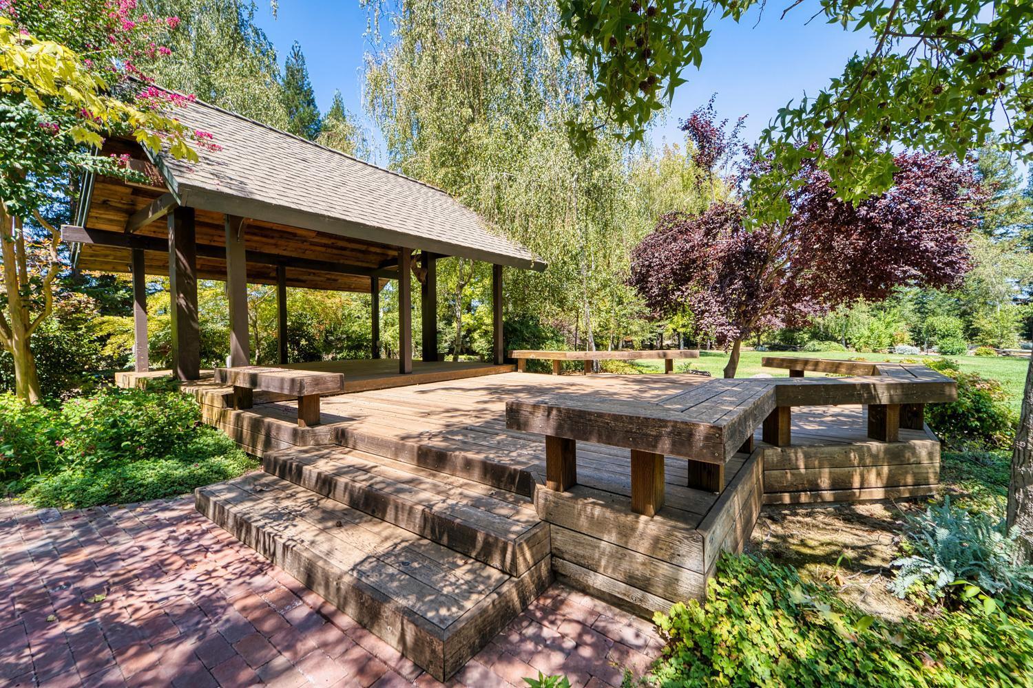 683 Stewart Road Yuba City, CA 95991 - Photo 25 of 55 an outdoor space with seating area and trees