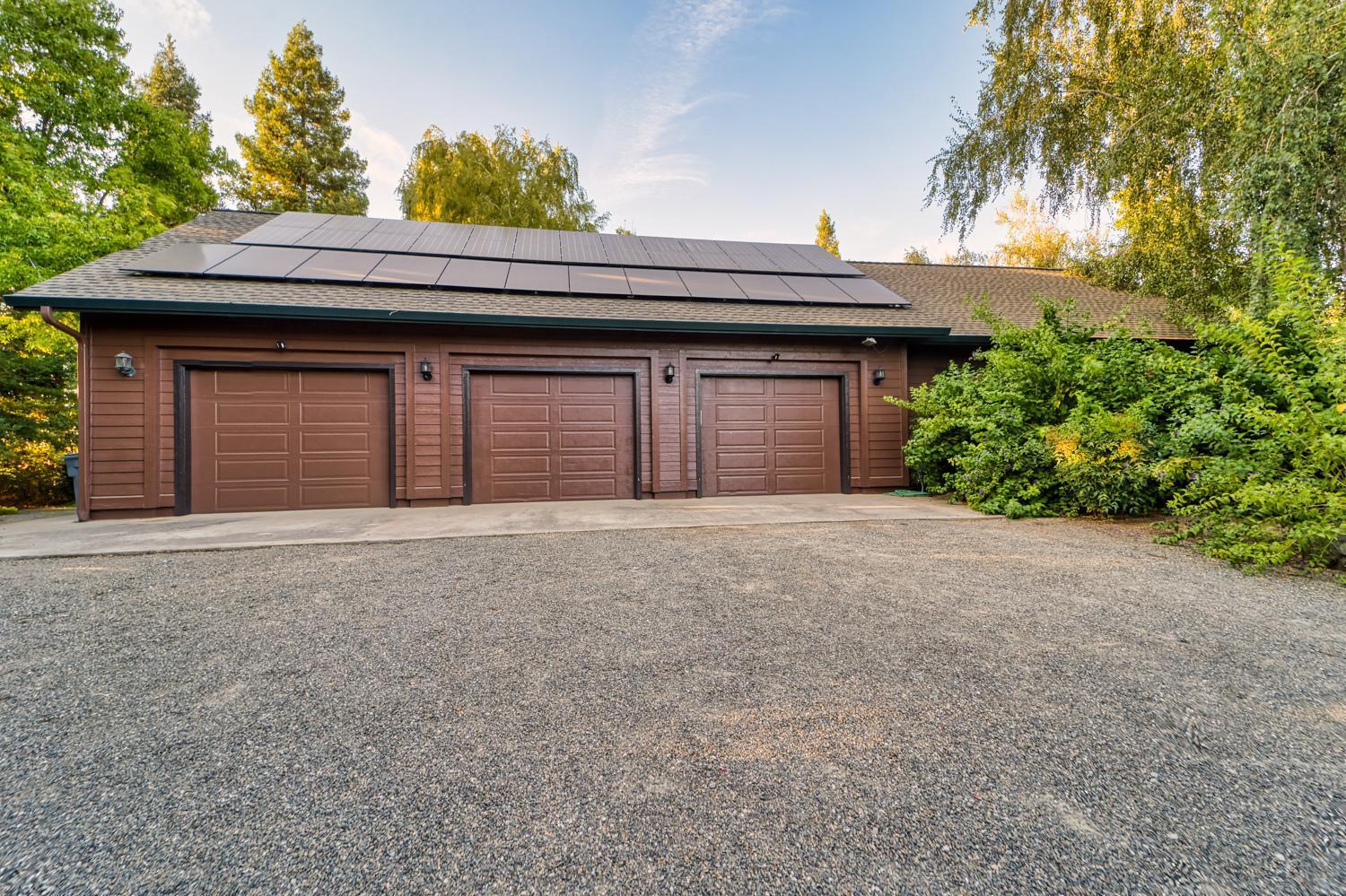 683 Stewart Road Yuba City, CA 95991 - Photo 27 of 55 a front view of a house with a yard and garage