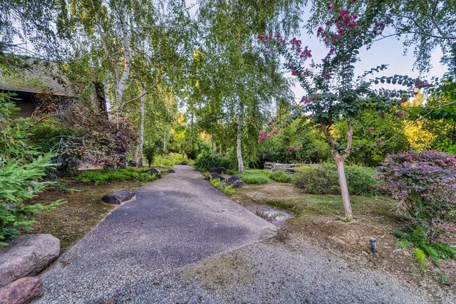 a front view of a house with garden