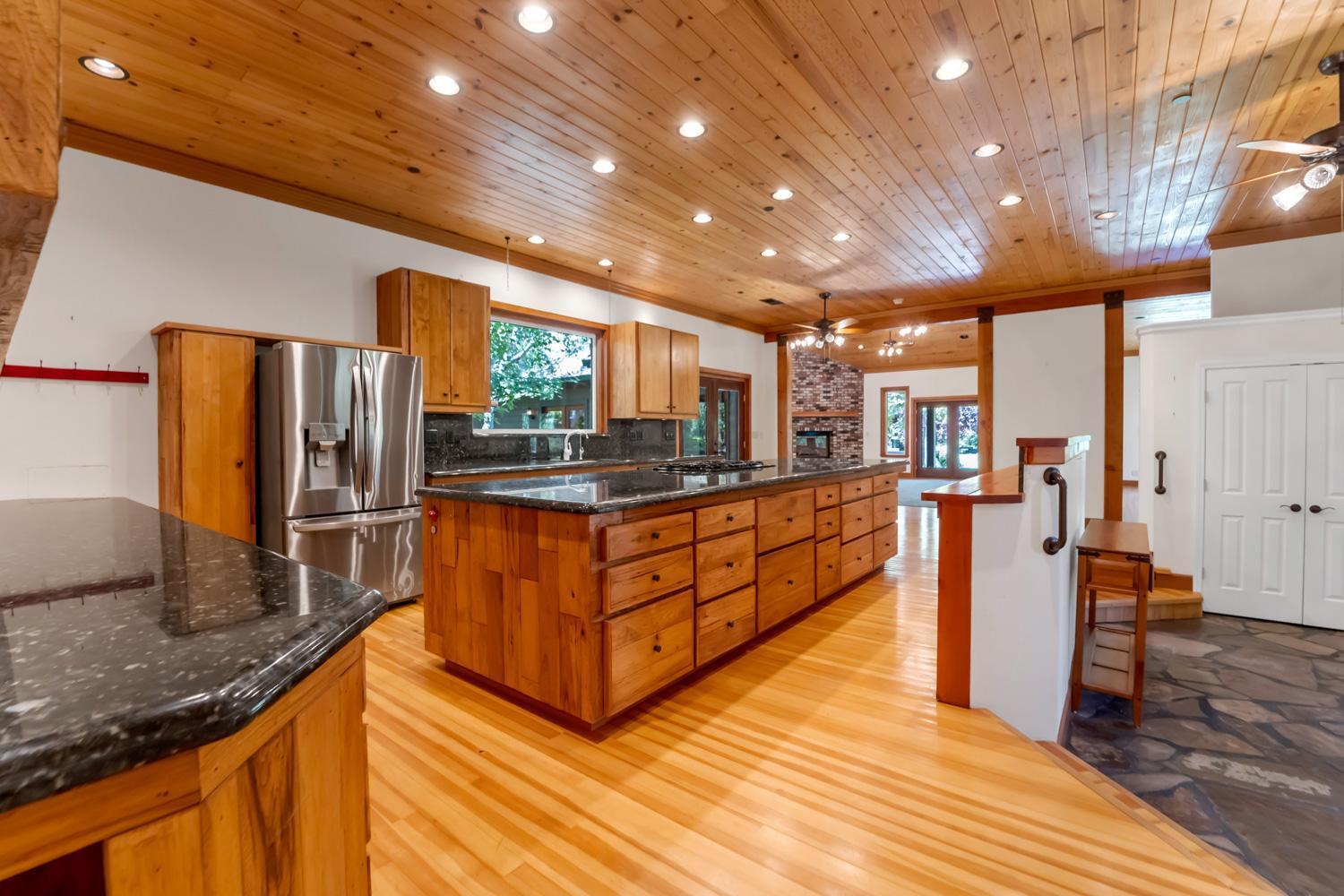 683 Stewart Road Yuba City, CA 95991 - Photo 3 of 55 a kitchen with stainless steel appliances granite countertop wooden cabinets a sink and dishwasher